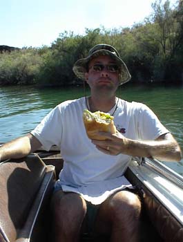 David Dietrich eating a sandwich on Lake Havasu