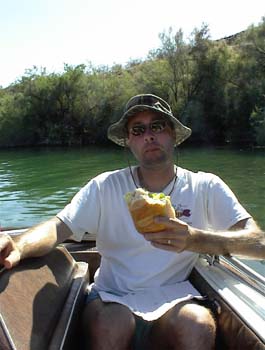 David Dietrich eating a sandwich on Lake Havasu